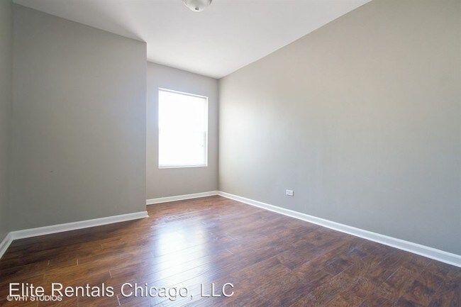 Building Photo - 4 br, 1 bath Apartment - 7542 S. Colfax Ave.