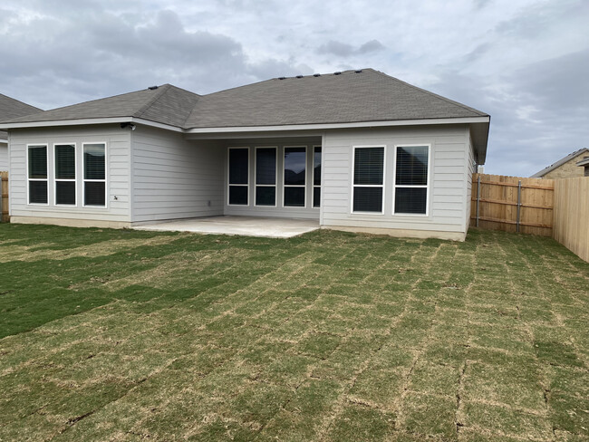 Backyard with Extended Patio. - 10231 Six Shooter Ln