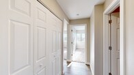 Located at 4348 N Chestnut St in Colorado Springs, Colorado, this two-bedroom unit offers a well-organized, single-floor layout designed for comfortable everyday living. The kitchen is equipped with rich cherry-toned cabinetry offering ample storage, light countertops, a stainless steel sink, and black appliances including a range and refrigerator. Wood-style flooring runs throughout the kitchen and main areas, adding warmth and easy maintenance. A central hallway connects the main spaces and features a full-panel sliding closet, providing convenient built-in storage. Both bedrooms are carpeted for comfort and benefit from natural light streaming through vertical-blind windows. Each room includes a ceiling fan with light fixture and baseboard heating. The primary bedroom is notably spacious, with a built-in closet and a bright window. Neutral beige wall tones are consistent throughout the unit, creating a clean, cohesive aesthetic. The overall layout is efficient and practical, making effective use of the available footprint while offering the essential features needed for day-to-day living in Colorado Springs.
