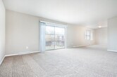 Located at 3111 Stevens St in Madison, Wisconsin, this single-floor, 3-bedroom, 2-bathroom home offers a well-organized and functional layout. The open living area is generously sized, featuring neutral-toned carpet and multiple windows that bring in natural light, creating a bright and welcoming atmosphere. Connecting hallways with light-tiled flooring guide you through the home with ease.

The kitchen is a standout feature, equipped with dark wood cabinetry, white quartz countertops, and a full suite of stainless steel appliances including a refrigerator, range, microwave, and dishwasher. Light-format tile flooring completes the modern, clean aesthetic.

The three bedrooms are carpeted and bathed in natural light through well-sized windows. The primary bedroom includes a ceiling fan and offers a comfortable, spacious retreat. Each bedroom benefits from dedicated closet space, with three closets total distributed throughout the home.

Both bathrooms are finished with contemporary touches, including dark wood vanities, white countertops, and backlit mirrors. One bathroom features a glass-enclosed shower and a window for added natural light. Light tile flooring runs throughout the bathrooms and hallways, tying the home's design together cohesively. The overall palette of warm neutrals and modern fixtures gives the home a clean, move-in-ready appeal.