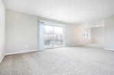 Located at 3111 Stevens St in Madison, Wisconsin, this single-floor, 3-bedroom, 2-bathroom home offers a well-organized and functional layout. The open living area is generously sized, featuring neutral-toned carpet and multiple windows that bring in natural light, creating a bright and welcoming atmosphere. Connecting hallways with light-tiled flooring guide you through the home with ease.

The kitchen is a standout feature, equipped with dark wood cabinetry, white quartz countertops, and a full suite of stainless steel appliances including a refrigerator, range, microwave, and dishwasher. Light-format tile flooring completes the modern, clean aesthetic.

The three bedrooms are carpeted and bathed in natural light through well-sized windows. The primary bedroom includes a ceiling fan and offers a comfortable, spacious retreat. Each bedroom benefits from dedicated closet space, with three closets total distributed throughout the home.

Both bathrooms are finished with contemporary touches, including dark wood vanities, white countertops, and backlit mirrors. One bathroom features a glass-enclosed shower and a window for added natural light. Light tile flooring runs throughout the bathrooms and hallways, tying the home's design together cohesively. The overall palette of warm neutrals and modern fixtures gives the home a clean, move-in-ready appeal.