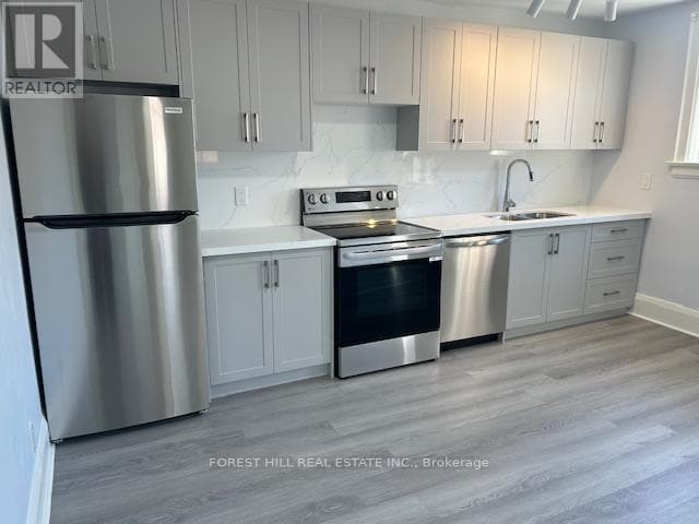 Photo du bâtiment - 411-411 Spadina Rd