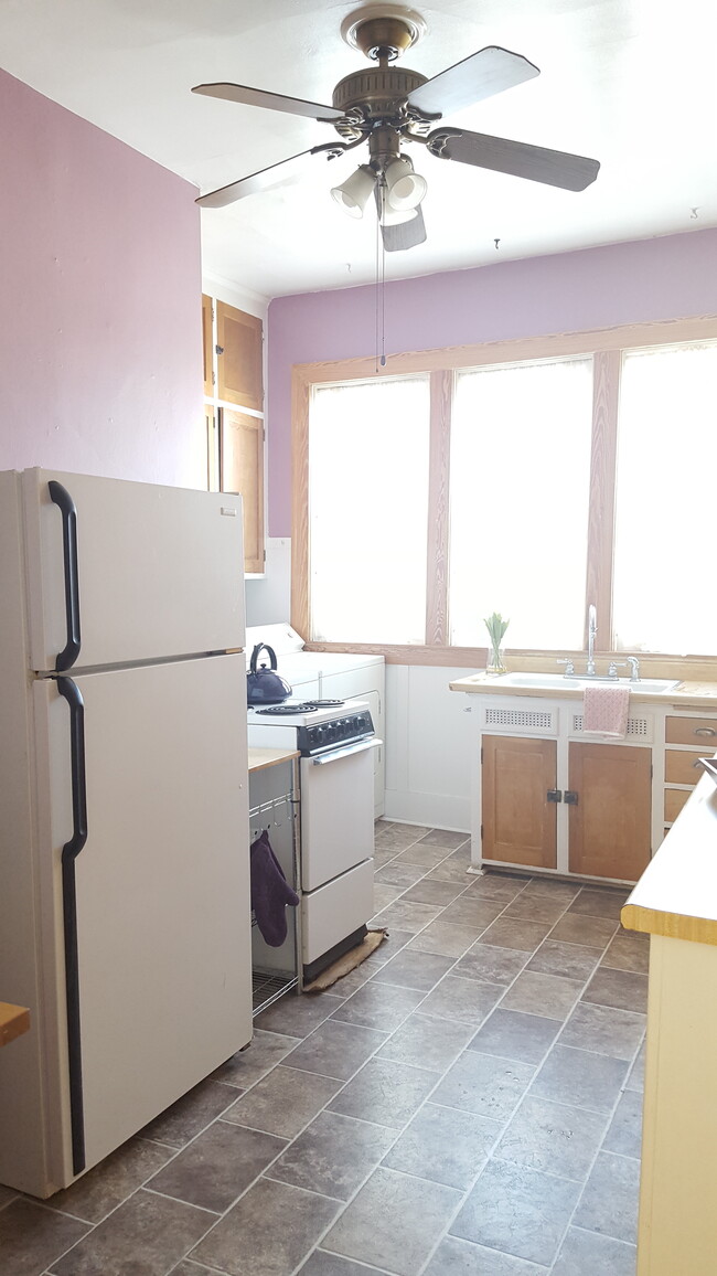 Kitchen view 2 with washer and dryer in background - 1502 Park Ave