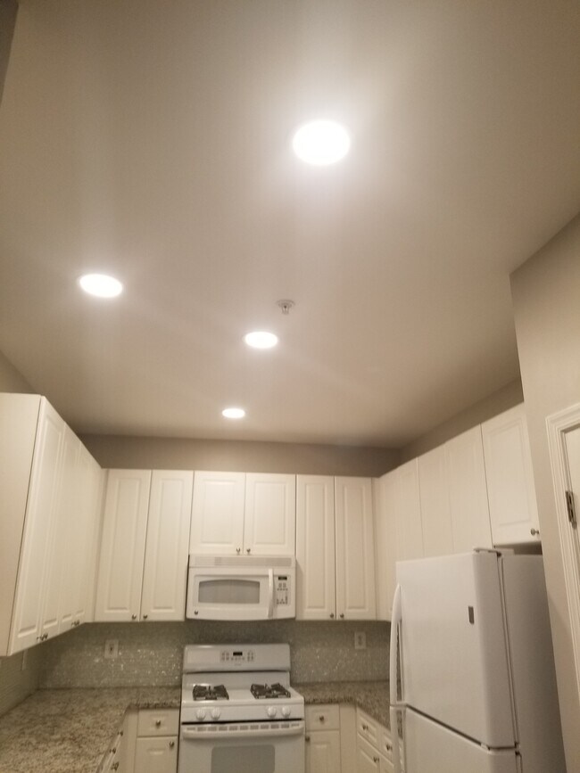 Kitchen with updated recess lighting - 2720 Bellforest Ct