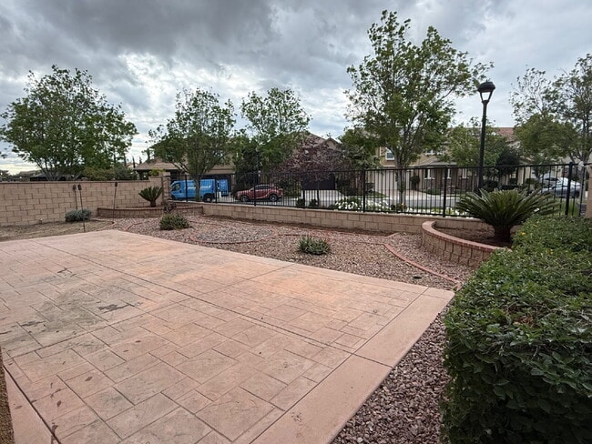 Photo - New flooring & paint!  Large backyard - landscaped and ready for garden!   Community pool, fitnes... Apartment