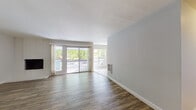 Located at 3599 Pennsylvania Ave in Fremont, California, this single-floor residence offers a well-organized layout with a blend of practical design and comfortable living spaces. The open living area is finished with durable wood-style flooring and neutral-toned walls that create a bright, airy atmosphere. A white-tiled fireplace accent wall adds a classic touch, while large sliding glass doors open to a private balcony overlooking lush greenery, filling the space with abundant natural light.

The galley-style kitchen is efficiently designed, featuring white cabinetry with brushed nickel hardware, dark granite-style countertops, tile flooring, and black appliances including a refrigerator, range, and dishwasher. An adjoining area with tile flooring connects the kitchen to the rest of the home seamlessly.

The bedrooms are carpeted for comfort, each equipped with ceiling fans and mirrored sliding closet doors that enhance the sense of space. One bedroom includes a window with outdoor views, while both offer practical built-in storage.

Two full bathrooms serve the residence, each finished with tile flooring, vanities featuring dark countertops and white cabinetry with brushed nickel hardware, and shower-tub combinations. The overall aesthetic throughout is clean, functional, and move-in ready.