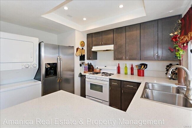 Building Photo - 2 br, 1.5 bath House - 12241 Carnation St. #C