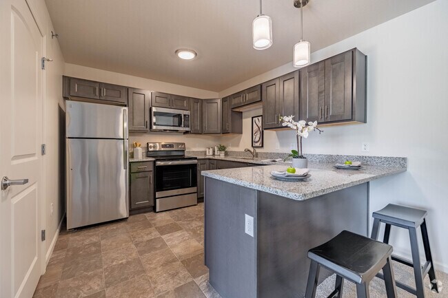 2 habitaciones, 1 baño - 825 pies cuadrados - Cocina - Fieldchase Senior Apartments