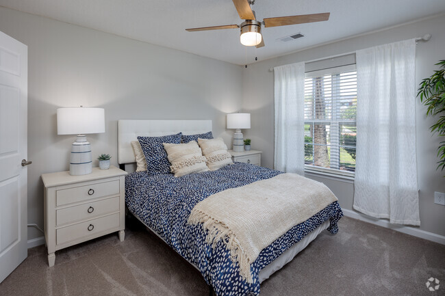 Primary bedroom from doorway. - Seaside Grove Apartments