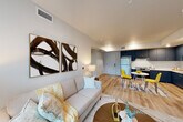 Located at 544 Alves Ln in Bay Point, CA, this 2-bedroom, 1-bathroom single-story residence offers a thoughtfully designed open-concept layout that maximizes the use of its compact footprint. Light wood-tone flooring runs throughout, creating a warm and cohesive aesthetic across all rooms.

The combined living, dining, and kitchen area forms the heart of the home. The kitchen stands out with bold navy blue cabinetry, white countertops, and stainless steel appliances including a refrigerator and range. A cozy dining nook sits adjacent to the kitchen, ideal for everyday meals. The living area benefits from a large window that brings in generous natural light and offers outdoor views of surrounding greenery.

Both bedrooms are comfortably proportioned, with the primary bedroom featuring a large window, a closet, and a neutral color palette that contributes to a calm, restful atmosphere. Three closets throughout the home provide ample storage. The full bathroom includes a tub-shower combination with accessibility grab bars and a clean, minimalist finish with navy vanity cabinetry. The single-floor layout ensures easy, step-free navigation throughout the entire residence.