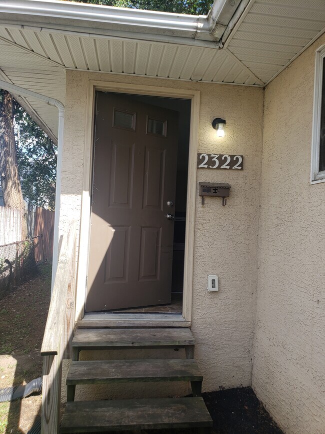 Showing 2322 entry half-way down on left side of building - 2322 Ontario St.