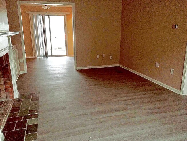 Newly updated flooring pictured here in the living room - 8 Meadowlawn Dr