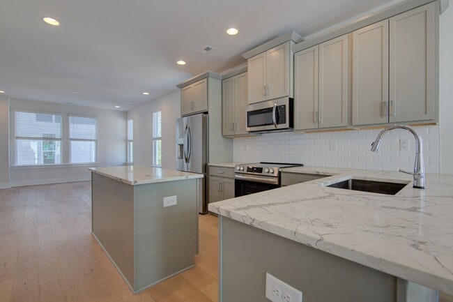 Building Photo - COMING SOON! Modern End-Unit Living Near Uptown | Rooftop Terrace + Tandem Garage