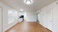 This 850 square foot home in Atlanta, GA offers a well-designed living space with three bedrooms and one bathroom. The single-story layout maximizes functionality within its compact footprint. The primary bedroom, measuring 140 square feet, provides a comfortable retreat.

The home features a mix of flooring types, with plush carpeting in the bedrooms and hallway, and sleek hardwood floors in the living areas. The recently renovated kitchen boasts modern appliances, including a stainless steel refrigerator and dishwasher. Granite countertops and white cabinetry create a clean, contemporary aesthetic.

The bathroom is efficiently designed with a white color scheme, featuring a bathtub-shower combination. Throughout the home, large windows allow for ample natural light, creating a bright and airy atmosphere. The living room offers a spacious area for relaxation and entertainment.

Storage is well-considered, with four closets distributed throughout the home. The neutral color palette of white walls provides a blank canvas for personalization. Ceiling-mounted light fixtures in each room ensure good illumination.

This property is ideal for small families, first-time homebuyers, or those seeking a low-maintenance living space in the Atlanta area. Its efficient design and modern updates make it a turnkey option for comfortable urban living.