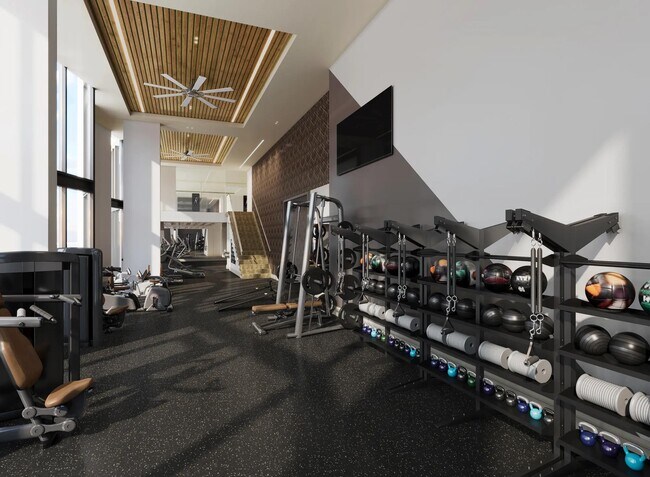 Estudio de fitness con calidad de club abierto las 24 horas, los 7 días de la semana, con sistema TRX, bicicletas de spinning y césped para actividades en Modera McGavock en Nashville, Tennessee. - Modera McGavock