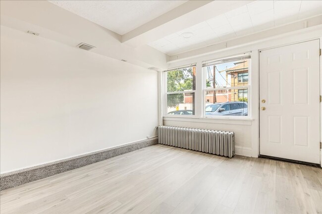 Building Photo - Spacious, Charming Victorian Style Tri-Ple...