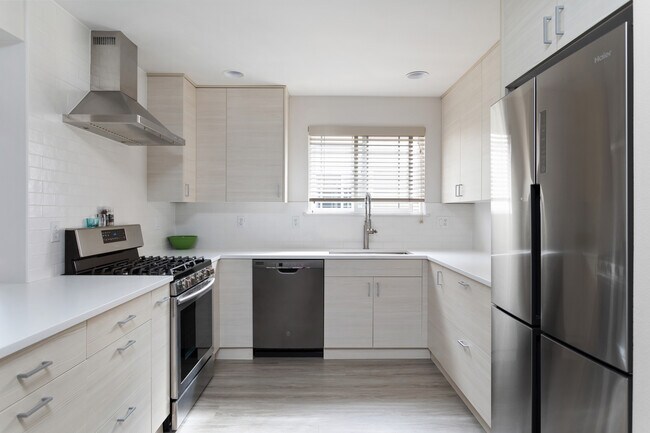 Pristine remodeled kitchen with quiet Haier fridge and all new appliances. - 8562 Stone Ave N