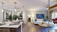 Located at 5604 Southwest Parkway in Austin, TX, this single-floor, 2-bedroom, 2-bathroom residence offers a thoughtfully designed open-concept layout that seamlessly connects the kitchen, dining, and living areas. Rich hardwood-style flooring flows throughout, complemented by crown molding and neutral tones that create a bright, cohesive atmosphere.

The kitchen is outfitted with dark espresso cabinetry, stainless steel appliances including a gas range and microwave, a subway tile backsplash, and a peninsula with light quartz countertops — ideal for both everyday meals and entertaining. Track and pendant lighting add a modern touch overhead.

The living room is warm and inviting, featuring a ceiling fan, crown molding, and a sliding glass door that floods the space with natural light and provides access to an outdoor area. The primary bedroom is generously proportioned, with a ceiling fan and natural light from a large window, offering a comfortable retreat. The second bedroom mirrors this comfort with its own ceiling fan and natural light.

Both bathrooms are clean and functional, with one featuring a full tub-shower combination with white tile surround. A dedicated in-unit laundry area with washer and overhead shelving adds everyday convenience. An entrance hallway and additional storage round out this well-organized residence.