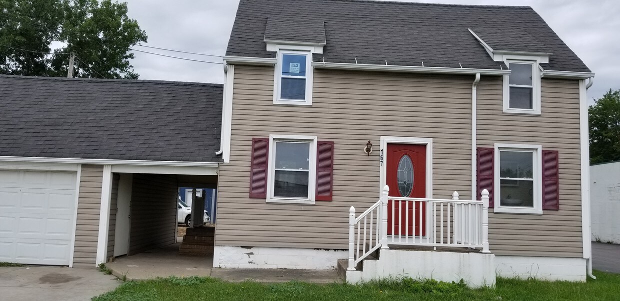 Front of House w/2 car garage - 167 Lee Rd