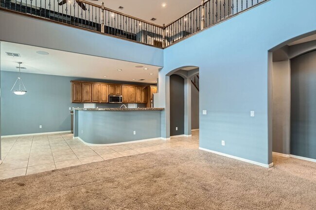Building Photo - Gorgeous 5 bd, 3 1/2 bath, 3 car in gated community with strip and mountain views!