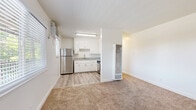 Located at 3430 Freedom Park Dr in North Highlands, CA, this 2-bedroom, 1-bathroom unit offers a practical and well-organized single-floor layout. The open-concept living and kitchen area creates a cohesive shared space, with the kitchen distinguished by light wood-style flooring, white shaker cabinetry, granite-style countertops, and stainless steel appliances including a refrigerator and gas range. A wall-mounted heater unit serves the living area, which features neutral carpet and a textured ceiling.

Both bedrooms are carpeted and feature ceiling fans with light fixtures, windows with blinds for natural light, and dedicated closets for storage. The primary bedroom offers a comfortable footprint with easy access to the hallway and shared bathroom. The bathroom is cleanly appointed with a white vanity featuring granite-style countertops, wood-style flooring, and a full bathtub with shower and a window for ventilation. Two hallways connect the rooms efficiently, and two closets provide additional storage throughout the unit. The overall aesthetic is clean and neutral, with white walls and consistent finishes across the space.