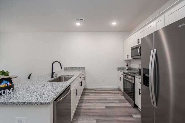 Building Photo - Brand-New Luxury Townhomes – Move-In Speci...