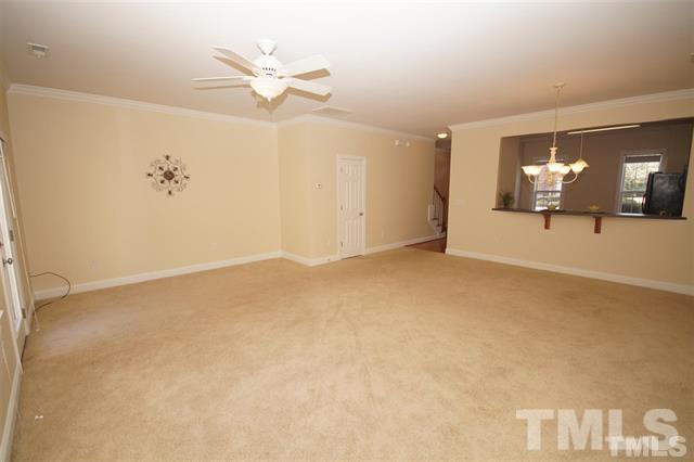 Living Room / Dining with door to downstairs half bath - 303 W Savannah Ridge Rd