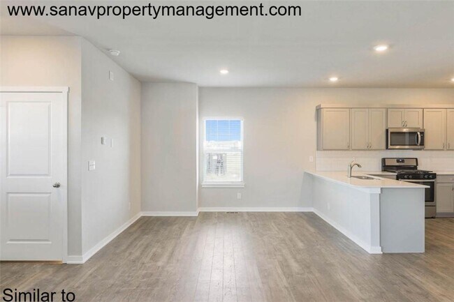 Foto del edificio - "Stylish 4-Bedroom Home in Prairie Trail with Modern Amenities"