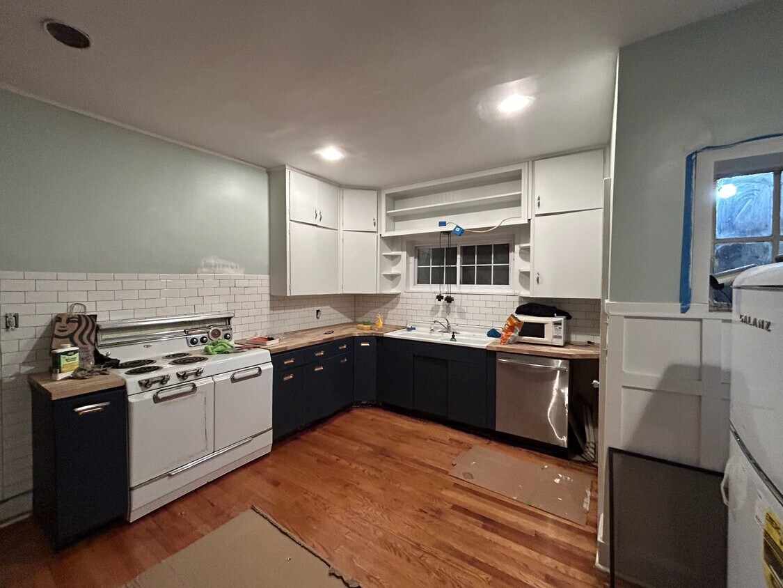 Kitchen newly renovated, finishing touches to be completed -open shelves above stove - 200 N Chilhowee Dr