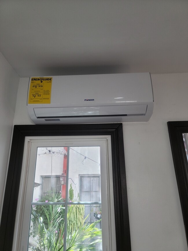 Air conditioning/heating combo unit in living room - 5832 Harold Way
