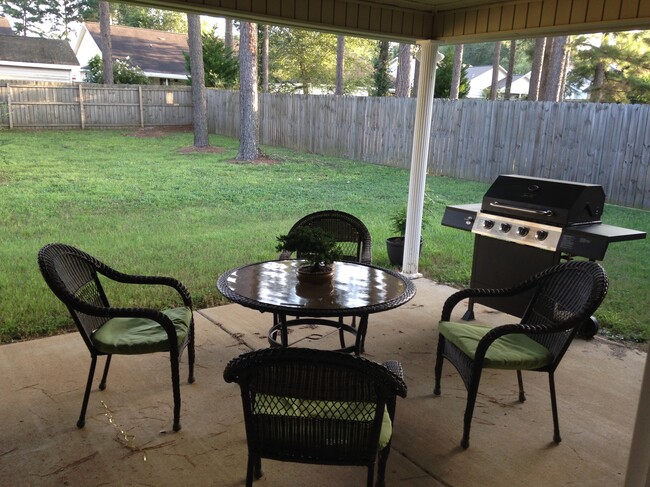 Covered back patio and fenced in yard - 113 Eufaula Drive