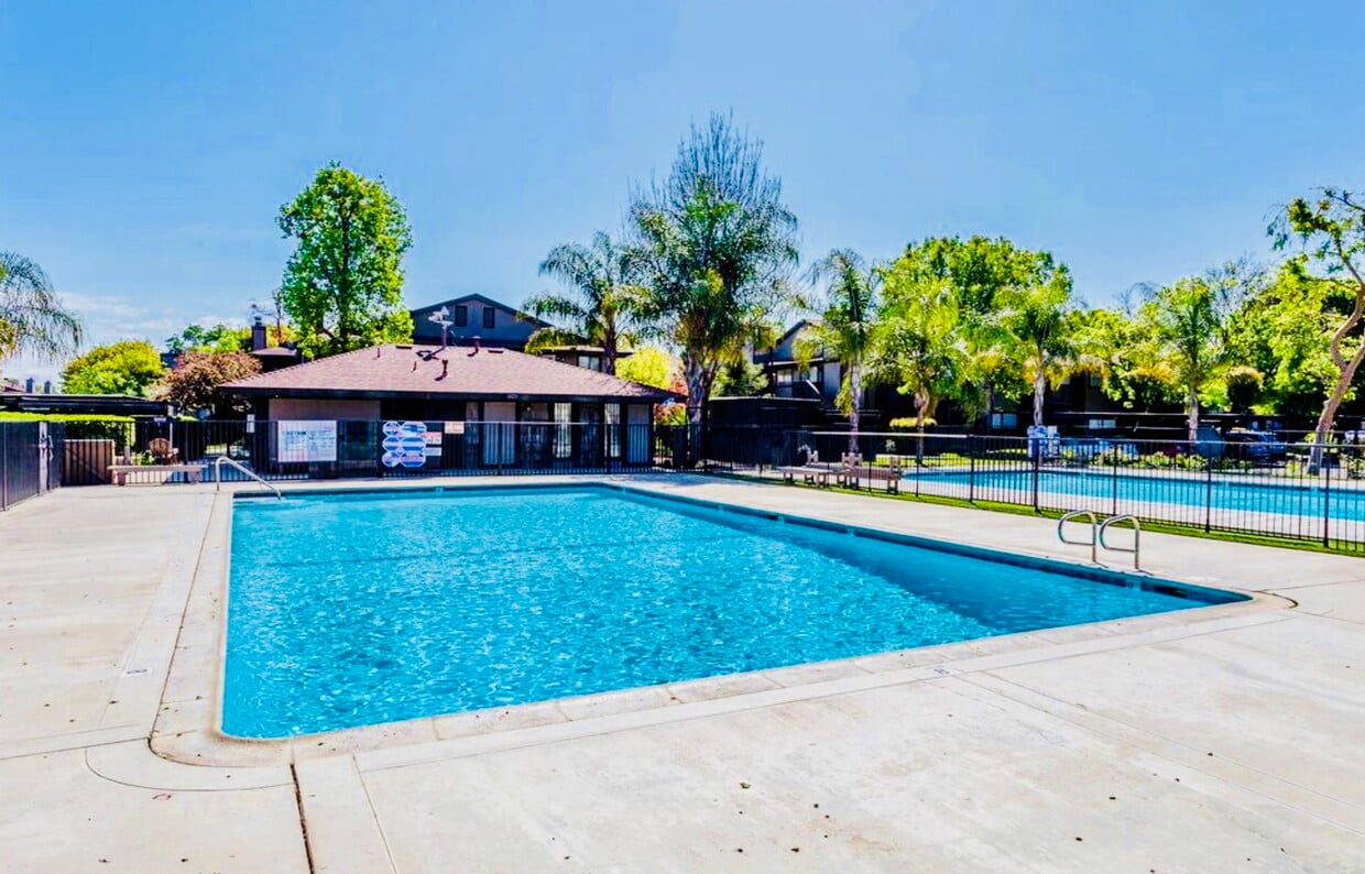 Swim in two beautiful sparkling clean and maintained gated swimming pools or relax in the jacuzzi hot tub. - 1190 S Winery Ave