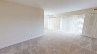 This 630 square foot apartment in Wilmington, Delaware offers a well-designed living space across a single floor. The property features two bedrooms, including a primary bedroom of 180 square feet, providing ample space for rest and relaxation. The living room is the heart of the home, boasting wall-to-wall carpeting and large windows that flood the space with natural light. Vertical blinds offer privacy control while maintaining a bright atmosphere. The bathroom is efficiently designed with a combination tub and shower, a single vanity, and clean white finishes. A hallway connects the living spaces and includes a closet for additional storage. The neutral color palette throughout the apartment creates a blank canvas for personal decorating styles. The property's layout maximizes the use of space, making it an ideal choice for those seeking a comfortable living environment in a convenient location.