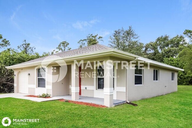 Foto del edificio - 1217 GRANT BLVD, Lehigh Acres, FL 33974