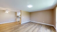 Located in National City, CA, this well-appointed 2-bedroom, 2-bathroom unit offers a comfortable and functional single-level layout. Light wood-style flooring flows consistently throughout the space, complemented by warm neutral-toned walls and crisp white baseboards that create a clean, cohesive aesthetic.

The combined kitchen and living area serves as the heart of the unit. The galley-style kitchen features white cabinetry with crown molding detail, granite-look countertops, a double sink, and white appliances including a range, microwave, and refrigerator. The living room is bright and open, with vertical blind-covered sliding glass doors that allow natural light to fill the space and provide outdoor access.

Both bedrooms are generously proportioned, with the primary bedroom offering a spacious layout. Each bedroom features the same warm wood-style flooring, neutral walls, and windows with vertical blinds that bring in natural light. The six-panel white interior doors add a traditional touch throughout.

The two bathrooms are functional and clean, each featuring a tub-shower combo with white surround, chrome fixtures, and matching neutral wall tones. A ceiling fan in the dining area adds both comfort and practicality. Overall, the unit presents a tidy, move-in-ready interior suited for everyday living.