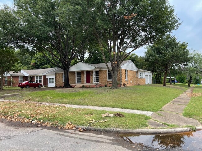 Front and side of the house - 102 E Ireland Dr