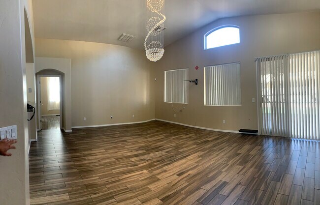 Living Room with High Ceiling & Chandelier - 5532 W Red Rock Ridge St
