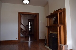 Front room with fireplace - 118 E 5th St