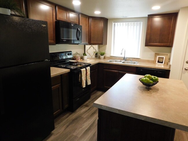 Updated Kitchen with Island - River Oaks Apartments & Townhomes