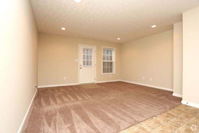 01 2BR, 1.5BA - 1,000 SF - Townhome With Garage - Living Room - Upper and Lower Stone Apartments