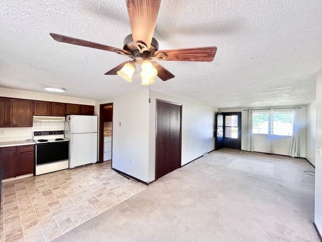Building Photo - NEW PAINT, FLOORING & APPLIANCES! 2 Bedroo...