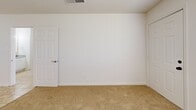 This 530 square foot apartment in New Orleans offers a practical layout in a single-floor design. The U-shaped kitchen is equipped with wooden cabinetry, a white electric stove, microwave, and refrigerator. Granite countertops and beige tile flooring complete the functional cooking space.

The living area connects seamlessly to the kitchen, featuring the same tile flooring for a cohesive look. A ceiling fan with lighting fixture provides comfort and illumination. The bedroom, measuring 130 square feet, is carpeted in a neutral tone and includes a window with blinds for natural light and privacy control.

The bathroom, while compact, includes a vanity with storage and a mirror flanked by Hollywood-style lighting. An in-unit washer and dryer stack in the bathroom, adding convenience to daily living. Throughout the apartment, white walls create a bright, airy atmosphere, allowing for personalization.

The apartment's layout, as seen in the 3D floor plan, showcases an efficient use of space with clearly defined areas for living, sleeping, and daily tasks. This single-bedroom unit offers a straightforward, no-frills living space ideal for individuals or couples seeking a low-maintenance home in the vibrant city of New Orleans.
