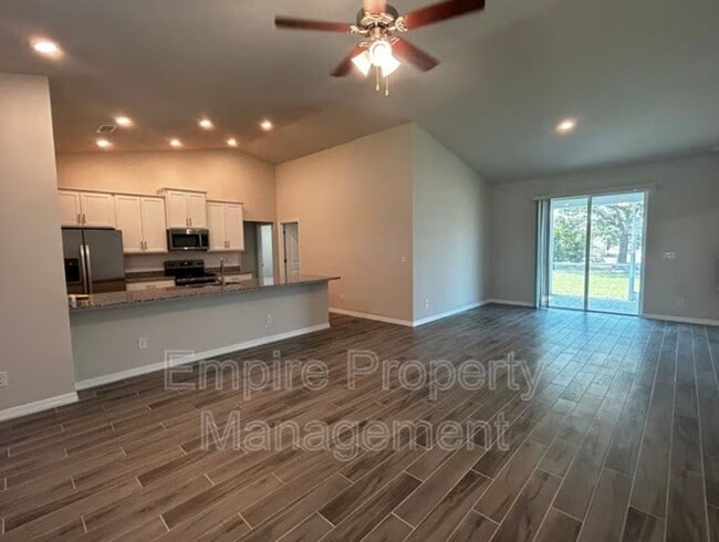 Building Photo - COMING MID-JUNE! 4 Bed 2 Bath 3 Car Garage with Screened Lanai