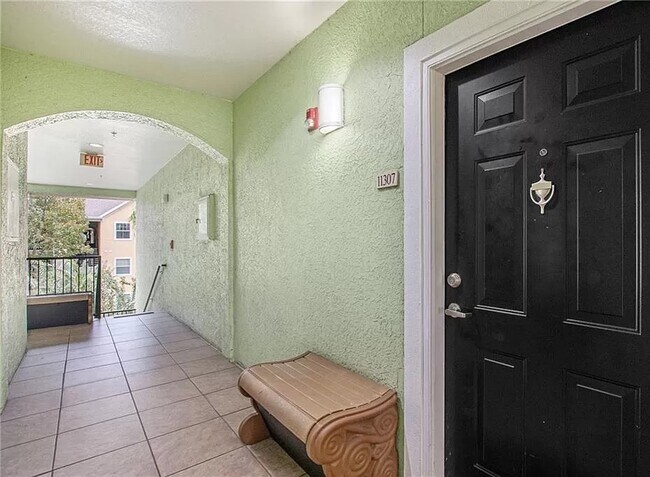 Condo Entryway located down from private garage parking spot - 1910 E Palm Ave
