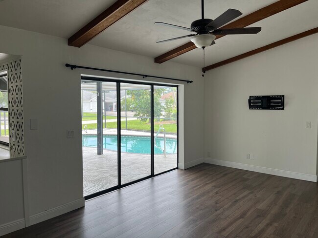 Family room with beamed ceilings and access to the pool. - 2316 Everest Pky