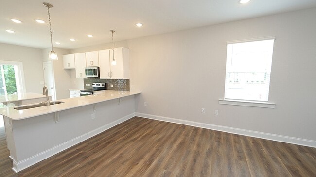 Building Photo - Brand New, End Unit Townhome Close to Down...