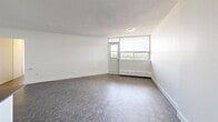 Located on the 11th floor at 3122 Hurontario Street in Mississauga, this two-bedroom, one-bathroom unit offers a well-organized layout with a bright and clean aesthetic throughout. The kitchen is a standout feature, equipped with stainless steel appliances including a refrigerator, stove, microwave, and dishwasher. White shaker-style cabinetry, a herringbone tile backsplash, dark countertops, and glossy tile flooring give the kitchen a modern, polished look. A structural column doubles as a breakfast bar, creating a natural separation between the kitchen and living areas. Both bedrooms are generously proportioned, featuring parquet-style flooring, baseboard heating, and large windows that invite abundant natural light and offer open views of the surrounding Mississauga cityscape. The primary bedroom includes full-width mirrored sliding closet doors, enhancing the sense of space. The bathroom is finished with classic white subway tiles surrounding a soaking tub, complemented by a window for natural ventilation. Hallways connect the rooms efficiently, contributing to a functional flow throughout the unit. The consistent use of light tones, parquet flooring, and textured ceilings creates a cohesive and inviting atmosphere across the entire space.