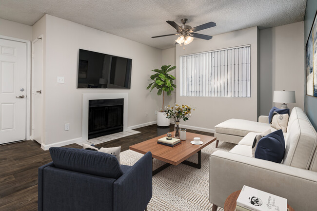 Diamond Living Room with Cozy Fireplace - Coral Point Apartments