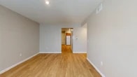 Located at 416 W Park Row Dr in Arlington, Texas, this single-floor, 2-bedroom, 2-bathroom residence offers a clean and functional layout designed for comfortable everyday living. Light wood-style flooring flows consistently throughout the unit, creating a cohesive and bright aesthetic from room to room.

The open living area connects seamlessly to the kitchen, which features warm-toned wooden cabinetry, ample overhead storage, recessed lighting, and white appliances including a refrigerator, electric range, and dishwasher. The layout provides efficient use of the cooking and prep space.

Both bedrooms are well-proportioned and filled with natural light from large windows dressed with blinds. The primary bedroom offers a generous footprint, while the second bedroom provides comfortable space for guests or a home office. Each room benefits from dedicated closet storage, contributing to overall organization throughout the unit.

The two bathrooms are practically designed; one features a full tub-shower combo with clean white fixtures, while the second includes accessibility-friendly grab bars for added safety and convenience. Hallways connect the living spaces efficiently, maintaining an easy flow throughout.

With neutral wall tones, consistent flooring, and a straightforward layout, this residence presents a tidy, move-in-ready environment in a well-situated Arlington location.