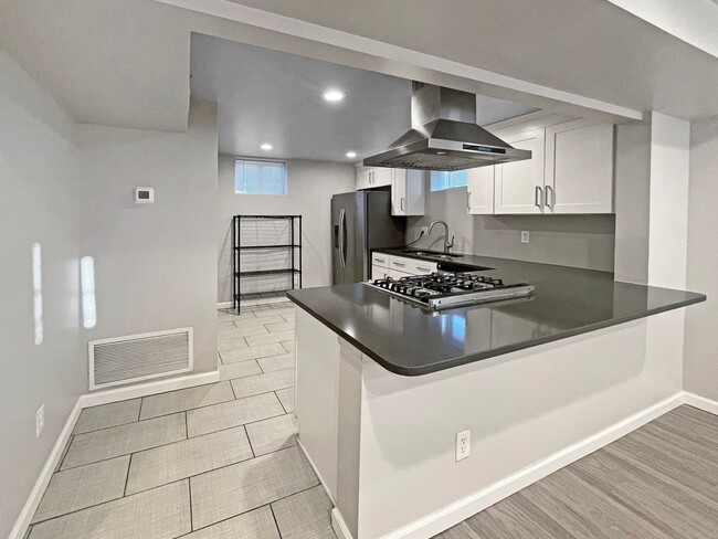 Building Photo - 2 BED, 1 BATH GARDEN LEVEL CONDO NEAR SLOA...
